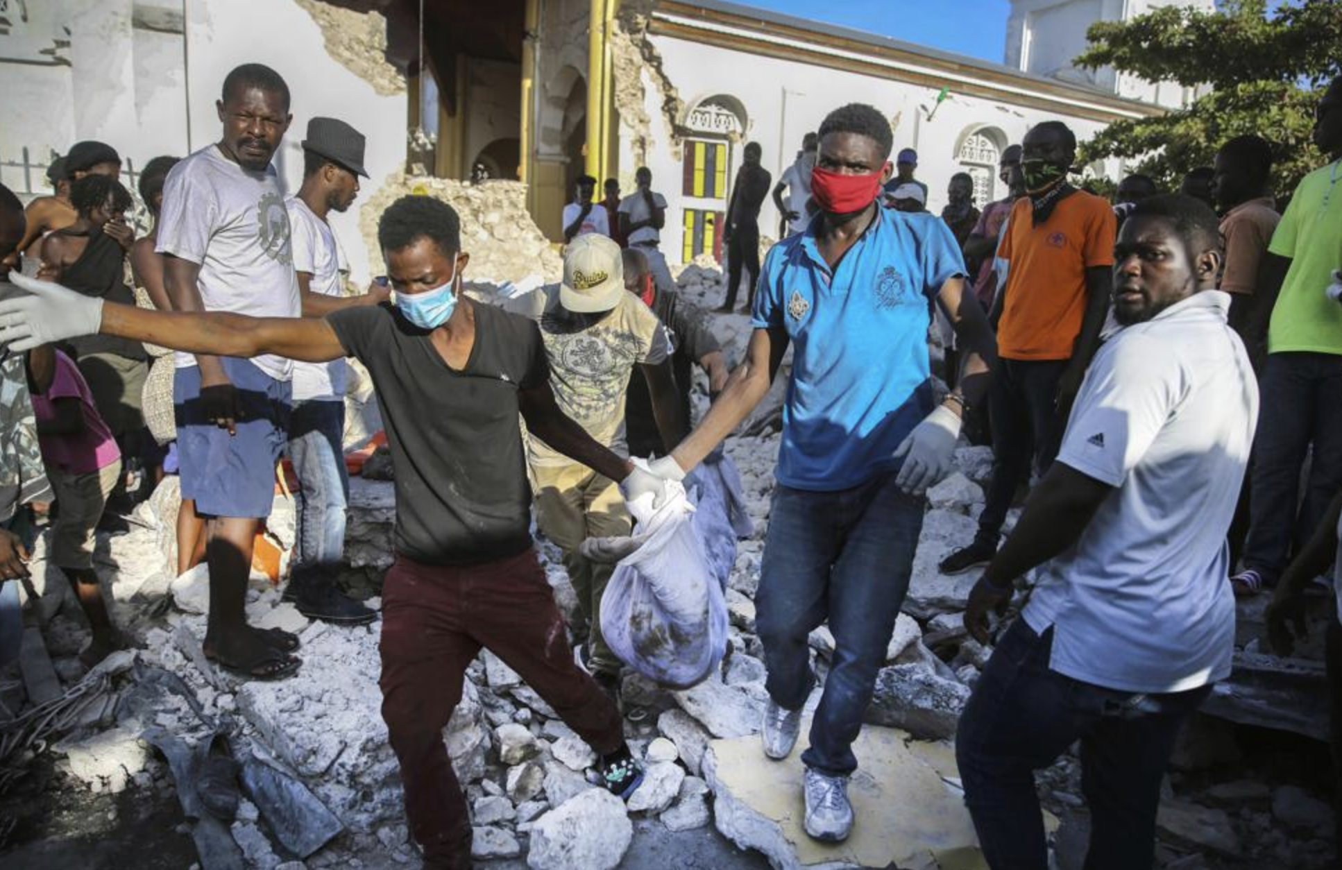 VIDEO: Haitians are searching collapsed buildings for survivors and the dead after the weekend’s massive earthquake