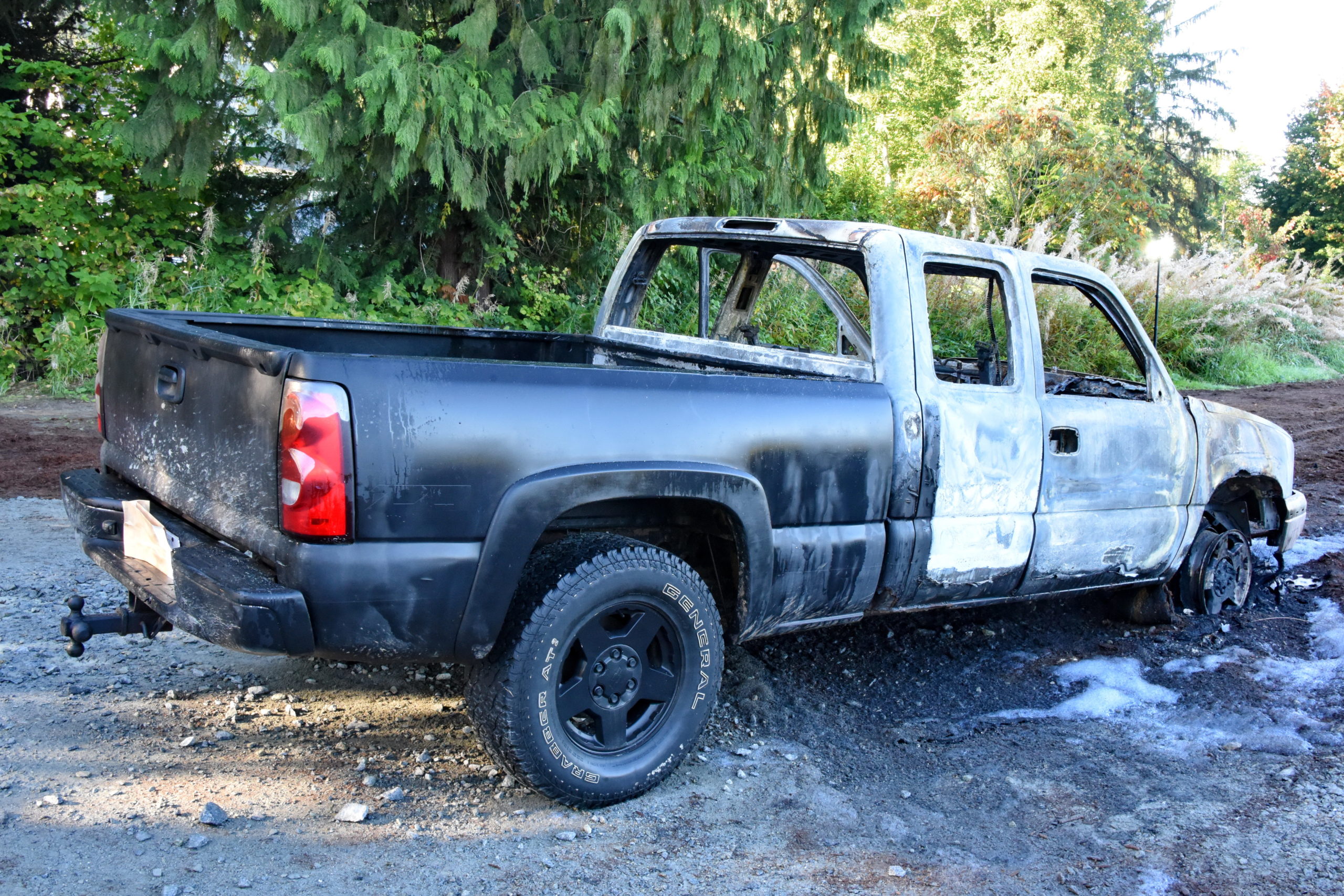 Burned out pickup truck with a body inside found in Ridge Meadows